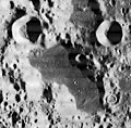 The dark, flat plain at the bottom is Schubert N. At the top are the craters Respighi (upper left) and Liouville (upper right). From Lunar Orbiter 1.