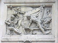 A relatively modern high relief (depicting shipbuilding) in Bishopsgate, London. Some elements jut out of the frame of the image.