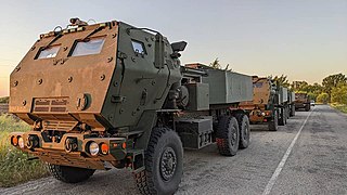 HIMARS rocket artillery systems parked in a line