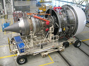 Trent 900 thrust loads are transferred from the engine through 2 thrust links (shown with orange maintenance protective sleeves) connected to the engine rear mount and wing pylon.