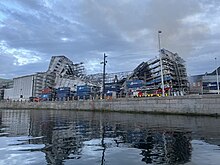 The damaged roof of Børsen and the scaffolding caving in