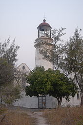 A photo of a worn down lighthouse