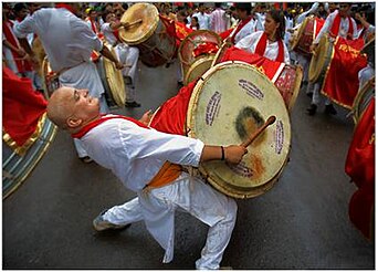 Artist playing traditional Puneri Dhol