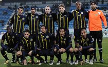 The Maccabi Tel Aviv team lines up at Bloomfield Stadium during a UEFA Europa League match in 2011.