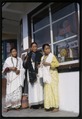 Coronation of King in April 1965. Three Nepalese women standing in front of Tse Ten Tashi's photograph studio, Gangtok, Sikkim.