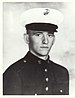 A black-and-white photo of Newlin from the waist up in his military dress blue uniform with hat.