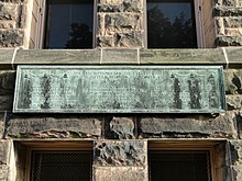 A bronze plaque which reads: "The inscriptions on the largest three of the fifteen bells in this tower are: 1. The classes of 1914 to 1921 inscribe this bell in grateful tribute to Edmund Janes James, president 1904 to 1920, a gifted and inspiring leader, an educational statesman. 2. This bell commemorates the patriotism, resolution, and zeal of the men trained here in the United States School of Military Aeronautics. 3. Through these chimes the classes of 1914, 1915, 1916, 1917, 1918, 1919, 1920, and 1921 call the multiplying and majestic company of students and graduates to join them in gratitude, loyalty, and devotion to their alma mater." At the bottom of the plaque reads: "The clock which strikes the hours and quarters commemorates the allegiance of the class of 1922."