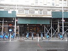 The Clark Street entrance to the Hotel St. George and the Clark Street subway station on the IRT Broadway-Seventh Avenue Line in Brooklyn Heights. A CitiBike rental station is located in front of the entrance.