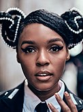 A picture of Janelle Monáe smiling towards the camera
