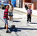 Image 12Plaquita, a Dominican street version of cricket. The Dominican Republic was first introduced to cricket through mid-18th century British contact, but switched to baseball after the 1916 American occupation. (from History of cricket)