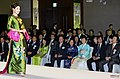 Woman in a fashion show wearing a kiềng.