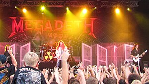 Megadeth playing music at a concert in 2010