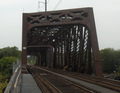 The Baltimore and Ohio Railroad Bridge, built in the late 19th or early 20th century as a two track, swing bridge across the Schuylkill River in the Grays Ferry neighborhood in Philadelphia, Pennsylvania. Now a CSX Philadelphia Subdivision bridge. View from the CSX Philadelphia Terminal, looking southwest.