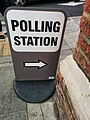 A sign with directions to a polling station, Holborn & St Pancras constituency. At the corner of Highgate Library.