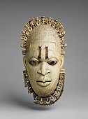 Benin ivory mask of the queen mother Idia; 16th century; ivory, iron & copper; Metropolitan Museum of Art. One of four related ivory pendant masks among the prized regalia of the Oba of Benin; taken during the Benin Expedition of 1897 in the Southern Nigeria Protectorate