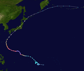 Satellite image of the path of the typhoon. It starts in the Pacific Ocean east of the Philippines, arcs through Japan, and ends near the Aleutian Islands.