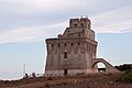 In primo piano la torre, nello sfondo una particolare sfumatura del cielo.