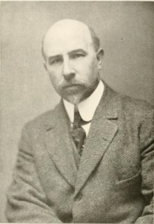 A sepia photographs of a man, shot from the waist up