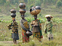 Batwa women with traditional pottery