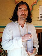 George Harrison, pictured here chanting Hare Krishna in Vrindavan, India in 1996