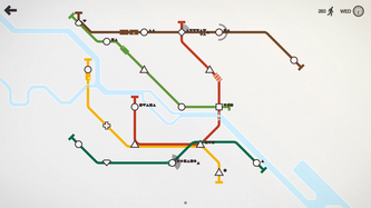 Une carte de métro comporte de nombreuses lignes colorées reliant des figures géométriques.