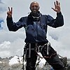 Mostafa Salameh raising seven fingers on completion of the last of the Seven Summits