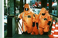 TFD firefighters operating inside Kasumigaseki Station with chemical protective clothing.