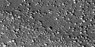 Close view of boulders along crater rim Boulders are roughly the size of cars or small houses. Picture taken with HiRISE under HiWish program.