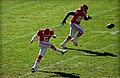 Connor Barth kicks off against New Orleans; Wallace Gilberry in background