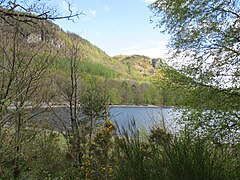 A view of Falcon Crag, with the eastern shore of Calfclose Bay, Derwent Water at its foot.