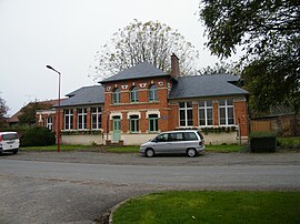 The town hall and school in Folies