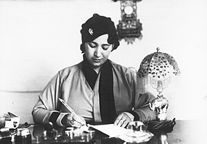 Gamila El Alaily in the 1950s sitting at her desk