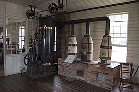 Three crucibles in Thomas Edison's Menlo Park Laboratory. At the left is a boiler and a small steam engine.