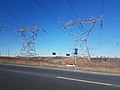 Low-profile 500 kV A/C single-circuit towers crossing a highway, near Toronto, ON