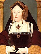 A portrait of Queen Catherine of Aragon, Henry the eight's first wife. She wears a black French-style gown with yellow undersleeves and a golden gable good