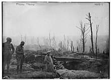 Photograph of French soldiers waiting in a trench.