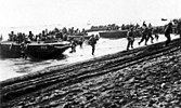 U.S. First Division Marines storm ashore across Guadalcanal's beaches on 7 August 1942