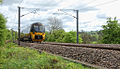 A Bradford-bound metro train rolls down the tracks near Burley station in Yorkshire.