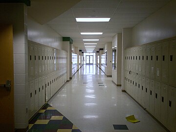Sixth grade hallway. The doorways with colors above them indicate an entrance to the "pod" of that color.