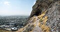 Panorama of Osh, (mosque in foreground) viewed from track to one of mountain caves