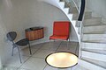 hall with spiral staircase and lighting in the floor