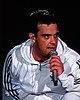 Colour photograph of Robbie Williams performing live in 2006