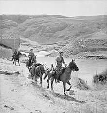 Photograph of three troops on horseback