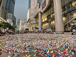 Near Time Square, thousands of origami paper cranes named "freenix" were folded and displayed by peaceful protesters.