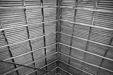 Fig. 3: The peaked roof has conventional ridge-pole framing, using milled timber.