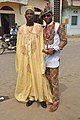 Image 7Cameroonian fashion is varied and often mixes modern and traditional elements. Note the wearing of sun glasses, monk shoes, sandals, and a Smartwatch. (from Cameroon)