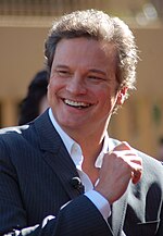Photo of Colin Firth receiving a star on the Hollywood Walk of Fame in 2011.
