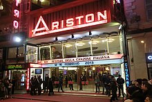 Teatro Ariston on night of contest with lit marquee