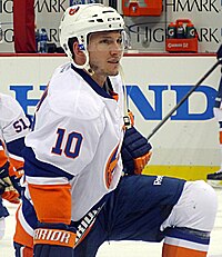 Keith Aucoin stretching on the ice.