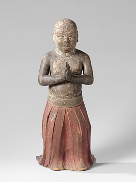 Statue of Shōtoku as a child, with hands pressed together in worship. Circa 1200-1350 CE